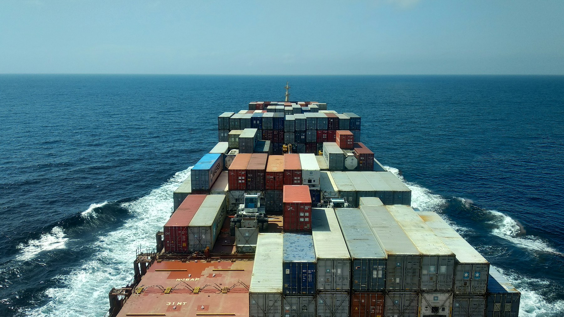 Container vessel carrying packed expandable houses by sea