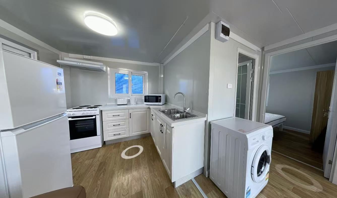 CGCH expandable house kitchen with appliances and cabinetry
